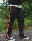 FIRE EMBROIDERY SIDE SNAP NYLON PANTS - FIRE RED